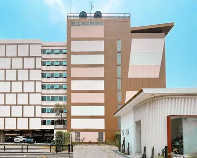 a tall building with a building at Crystal Place Parkkred in Nonthaburi