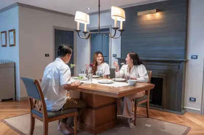 a group of people sitting around a table at THEA Private Suites by TH District in Bangkok