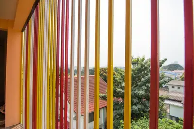a view from a window with colorful stripes at Bann In Suan in Ban Lat Tanot