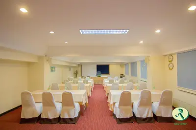 a large room with white tables and chairs in it at Regent Ramkhamhaeng 22 in Bangkok