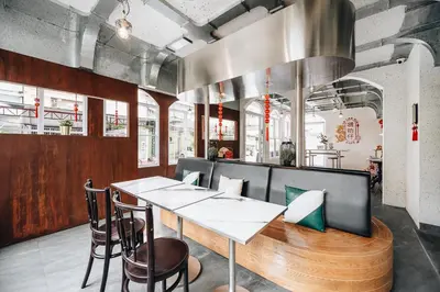 a dining room with a table and chairs at Talakkia Boutique Hotel in Bangkok