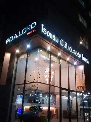 a store front with a christmas tree in the window at PDA Lord Hotel in Bangkok