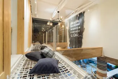 a store window with several umbrellas on display at The Pattern Boutique Hotel in Bangkok