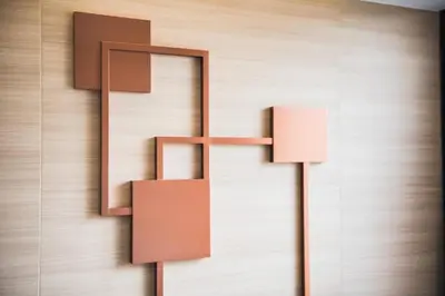 a wall with a mirror and two lamps on it at twothree a homely hotel - SHA Extra Plus in Bangkok