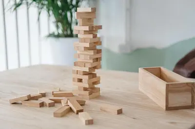 a tower of wooden blocks on a table at Ease Hostel in Bangkok