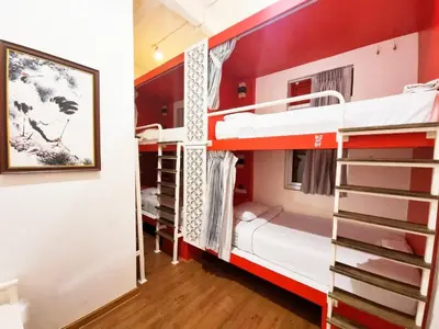 a room with bunk beds in a hostel at Ama Hostel Bangkok in Bangkok