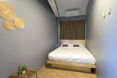 a bedroom with a bed in a room at Arun Old Town in Bangkok
