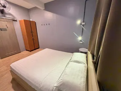 a bedroom with a large bed in a room at Arun Old Town in Bangkok