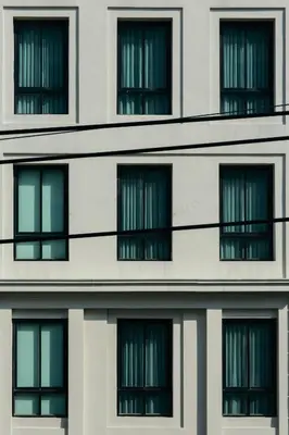 a building with many windows on the side of it at Thomson Residence Hotel in Bangkok