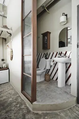a bathroom with a toilet and a sink at Ob-Oon Boutique Bed & Breakfast in Bangkok