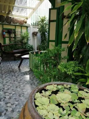 a large pond filled with lilies in a courtyard at Baan Tepa Boutique House in Bangkok