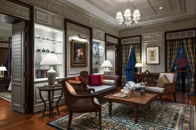 a living room with a couch and chairs and a table at The Athenee Hotel, a Luxury Collection Hotel, Bangkok in Bangkok