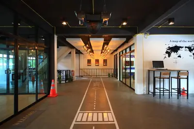 an empty hallway of a building with an orange cone at Tuk Tuk Hostel in Bangkok