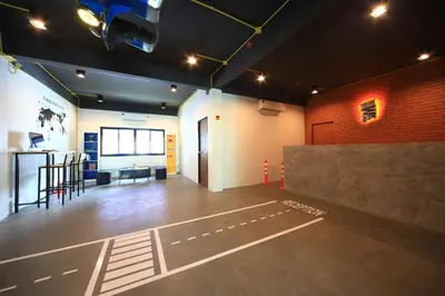 an empty room with a basketball court on the floor at Tuk Tuk Hostel in Bangkok