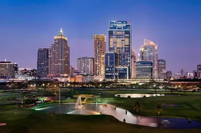 a view of a city skyline with a fountain at The St. Regis Bangkok in Bangkok