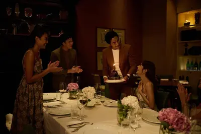 a man standing over a table with a cake at Sheraton Grande Sukhumvit, a Luxury Collection Hotel, Bangkok in Bangkok