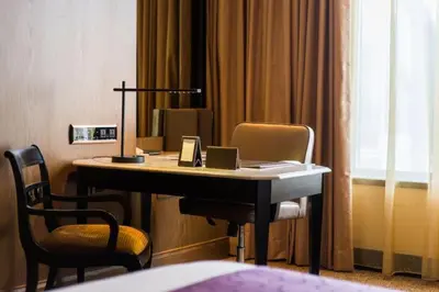 a desk with a laptop on it in a hotel room at Sheraton Grande Sukhumvit, a Luxury Collection Hotel, Bangkok in Bangkok