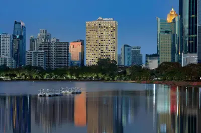 a group of boats in the water in a city at Sheraton Grande Sukhumvit, a Luxury Collection Hotel, Bangkok in Bangkok