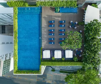 an overhead view of a pool at a resort at Le Meridien Bangkok in Bangkok