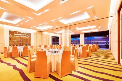 a conference room with tables and chairs and windows at Paradox Bangkok Sukhumvit in Bangkok