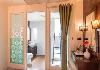 a bathroom with a toilet and a sink and a mirror at D&D Inn Khaosan in Bangkok
