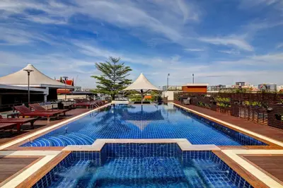 a pool on the roof of a building at Dang Derm Khaosan in Bangkok
