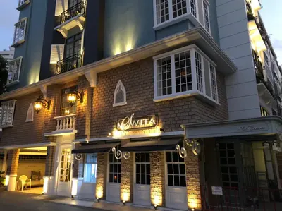 a building with lights on the front of it at M. Swita เอ็ม.สวิต in Bangkok