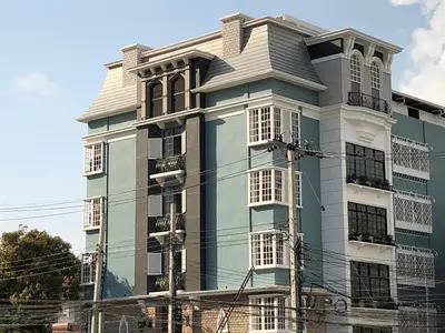 a blue and white building with a lot of windows at M. Swita เอ็ม.สวิต in Bangkok