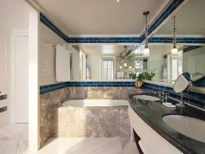 a bathroom with two sinks and a tub at Mandarin Oriental, Bangkok in Bangkok
