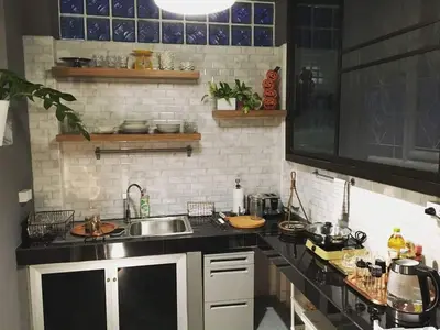 a kitchen with a sink and a counter top at TANA CASA 12 Large Sathorn 6BR Townhome with Parking in Bangkok