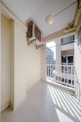 a balcony with a view of a building at Salin Home Hotel Ramkhamhaeng in Bangkok