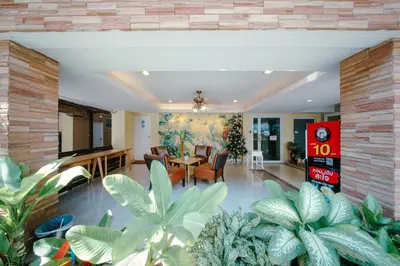 a living room with plants in the middle of it at Salin Home Hotel Ramkhamhaeng in Bangkok