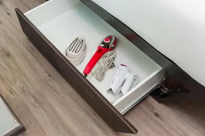 a drawer with a knife and shoes in it at Vib Best Western Sanam Pao in Bangkok