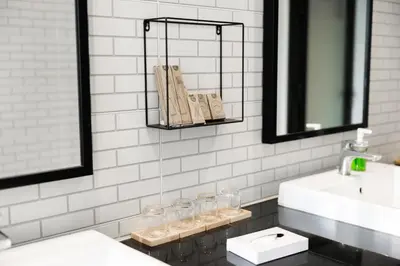 a bathroom with a sink and a mirror at The Royal River Hotel in Bangkok