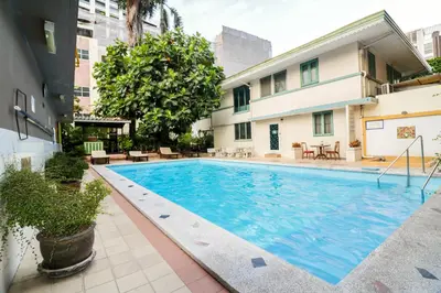 a swimming pool in the middle of a building at Malaysia Hotel Bangkok in Bangkok