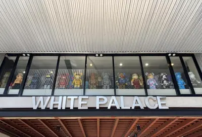 a white palace sign on top of a white palace store at White Palace Bangkok in Bangkok