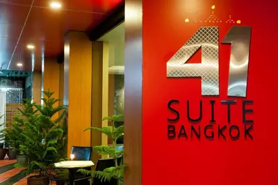 a red sign with the number four sitting in a lobby at 41 Suite Bangkok in Bangkok