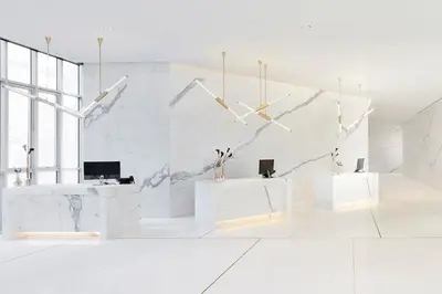 a white room with white walls and white tables at Somerset Maison Asoke Bangkok in Bangkok