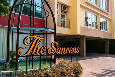 a building with a sign that reads the sun supreme at The Sunreno Hotel Bangkok in Bangkok