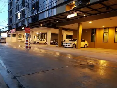 a parking lot with cars parked in a building at DB Plus 2 in Bangkok