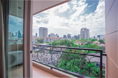 a balcony with a view of a city at Greenview Ekkamai10 Suite in Bangkok