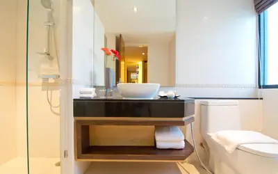 a bathroom with a sink and a toilet at Grand Lord Boutique Hotel -Srinakarin in Bangna