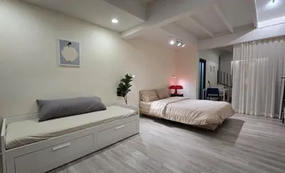a bedroom with two beds in a room at Wang Lang Hostel in Bangkok