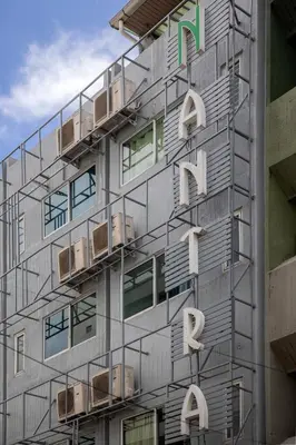 a building with balconies on the side of it at Nantra Silom in Bangkok