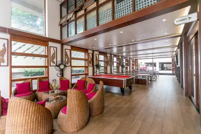 a pool room with couches and a pool table at A Room Bangkok Sathorn in Bangkok