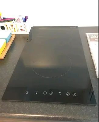 a laptop computer sitting on top of a counter at Gsuite Glamorous Apartment in Bangkok