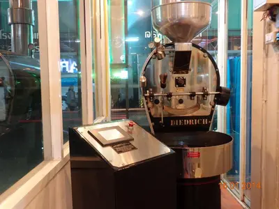 an old fashioned blender sitting in a store window at Lodge 61 Hotel in Bangkok