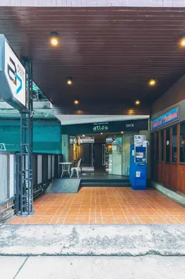 an entrance to a building with a bilt gas station at Atlas Bangkok Hotel in Bangkok