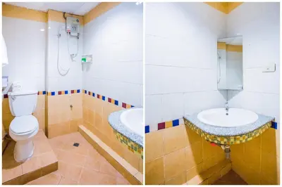 a bathroom with a toilet and a sink at Atlas Bangkok Hotel in Bangkok