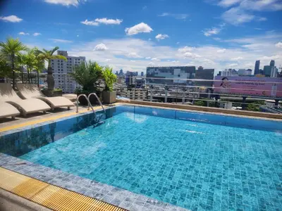 a swimming pool on the roof of a building at Interchange Tower Serviced Apartment - SHA Extra Plus in Bangkok